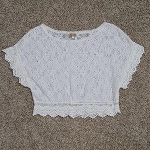 Lace crop top off white in color